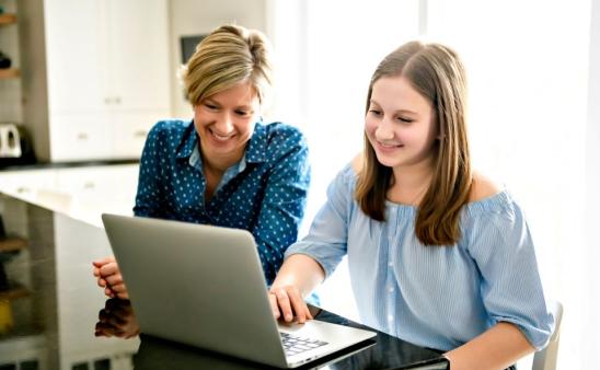 mom and daughter at computer